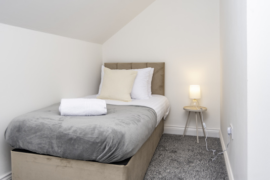 Top-floor bedroom with single bed (one of two singles in this room)