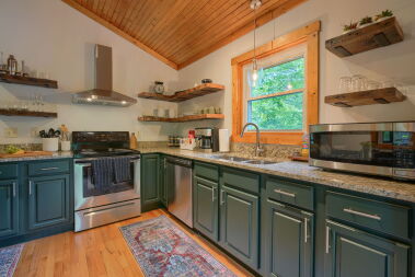 Updated modern kitchen fully stocked with dishwasher and coffee bar