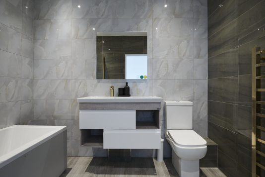 A fresh, well-maintained bathroom with essential amenities provided.