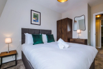 Comfortable bedroom with a king-size zip and link bed that can be separated into two singles upon request.