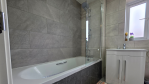Start and end your day in comfort. This modern family bathroom is fully equipped with a bath/shower combo and a thoughtful selection of quality toiletries, making your stay as relaxing and hassle-free as possible.

