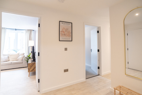 Bright hallway connecting the living area, Kitchen, bedrooms and bathroom.