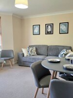 Living room - Make yourself comfortable, take a seat. Whether you're ready to unwind with a good movie, or you're looking forward to a tasty dinner, you'll be comfortable in our living room. 