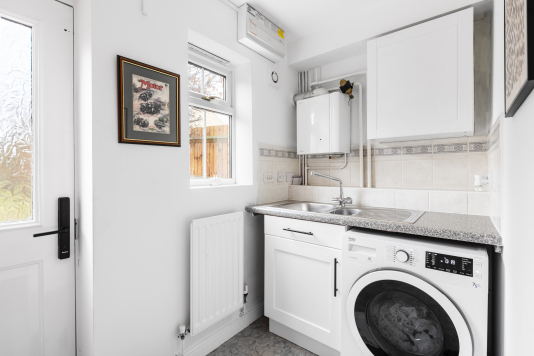 Utility room with. High quality washer dryer 