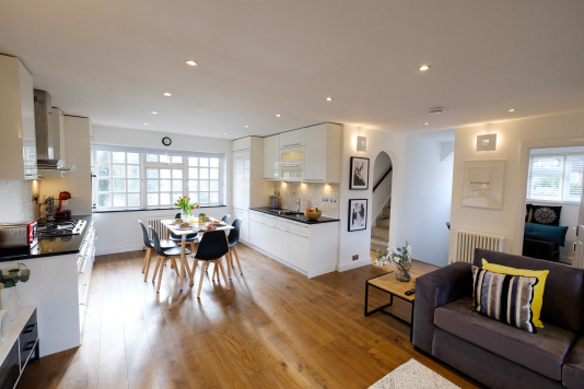 The stunning open-plan living/dining/kitchen area has solid-oak flooring and large double aspect windows which flood the space with light. The sofa bed converts to a comfortable double bed for larger groups of guests.