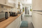 Brand new kitchen with utensils, new washing machine, fridge, microwave, oven, kettle, toaster, coffee, tea, sugar, milk