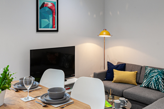 Breakfast bar, TV and corner sofa at Treetops