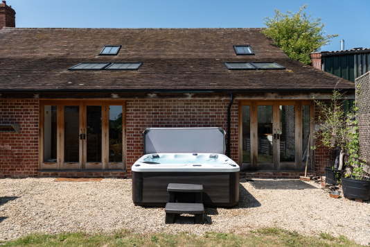 Private spa garden with hot tub, sauna & patio doors opening straight into your secluded outdoor space