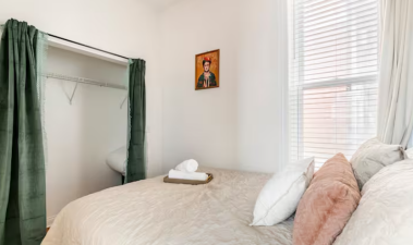 The bedroom also features a spacious closet, providing ample storage to keep your belongings organized while maintaining the room's elegant and serene atmosphere.