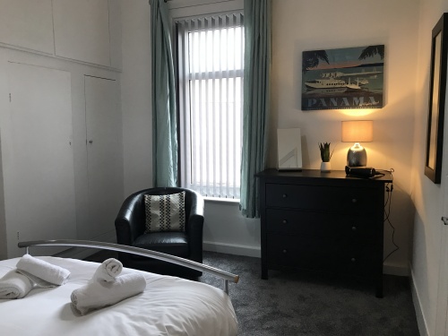 Bedroom Two - Comfy double bed, Chest of draws, hanging rail and seating area