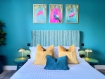 King-size bed with hypoallergenic bedding and linen.