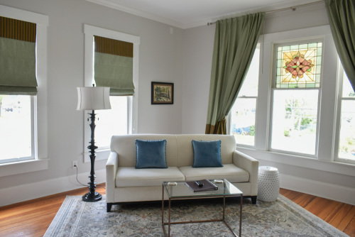Suite 1 sitting room with queen sleeper sofa & Smart TV