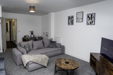 Comfortable living area with Smart TV, sofa bed and dining space