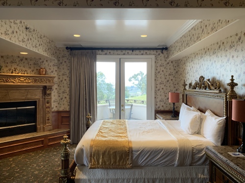 king bed with fire place and beautiful views