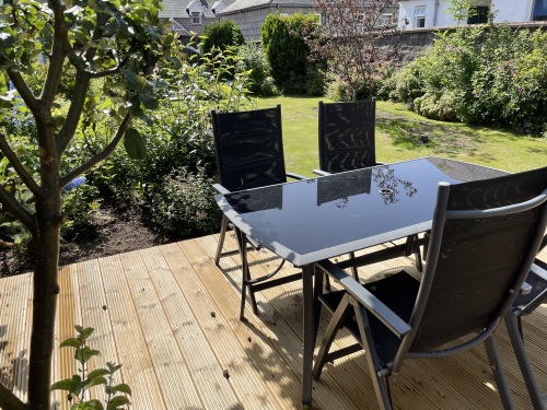 Patio Table for four people on decked area.