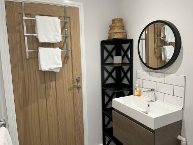 Bathroom with toilet, sink, bath & shower cubicle.