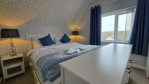 Sink into queen-size comfort. The third bedroom features a spacious bed that's perfect for a great night's sleep.