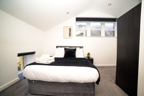 Relax and unwind in this cosy double bedroom, designed for a peaceful night’s sleep.
