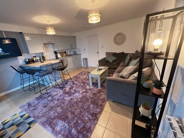 open plan living room with breakfast bar