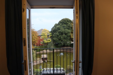 Balcony with pond view