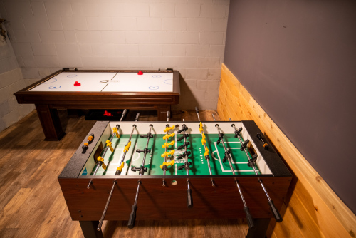 Lower level game room with foosball and air hockey tables