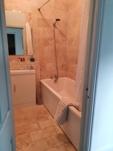 Lux Apatment self contained family bathroom with heated towel rail and various shampoos provided.