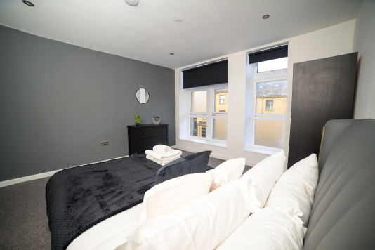 A comfortable double bedroom offering the perfect blend of comfort and simplicity.