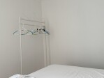 Bedroom three clothes hanging
