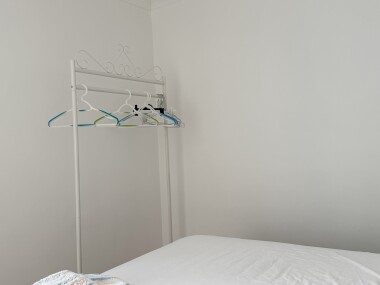 Bedroom three clothes hanging