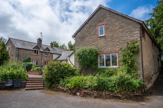 Character-Filled Stone Barn - Original stone walls and traditional slate roof, the heart of Old Mill Cottages estate, perfect for groups who want real Devon character and countryside soul.