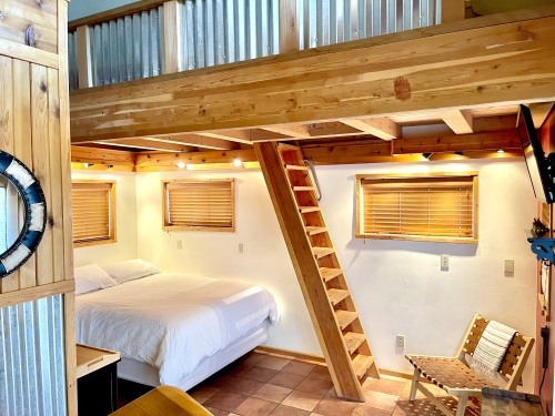 Queen bed and stairs to loft