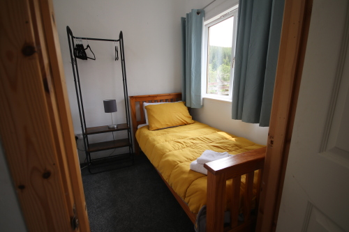 single bedroom with window to exterior