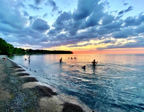 We have awesome swimming and great sunsets.  Swimming right off the public right of way.  Shallow gradual entry, small rocks and then sandy bottom. Our little cove is awesome!   And with the State park out back - great hiking and views. 