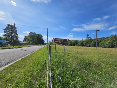 Road signs showing entrance to the property travelling from Inverness, entrance is on the left on the A835, 6 miles on from Garve