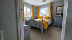 Designed with longer stays in mind, this spacious bedroom includes ample wardrobe and drawer space so you can properly unpack and make yourself at home. The private en-suite adds a touch of luxury, while the curated reading material invites you to kick back and relax.