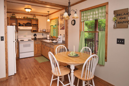 This fully equipped kitchen has all of the comforts of home including a wide array of appliances, cooking utensils, bake ware, and service for four.