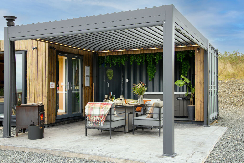 [{'Text': 'Covered terrace area', 'CultureCode': 'en-GB'}] glamping cabins and grounds, photo 24 of 32