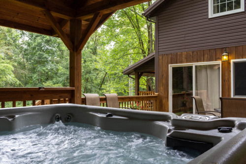 Enjoy a nice soak in our covered hot tub 