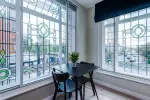 Spacious living room with comfortable seating and inviting atmosphere, perfect for relaxing or socialising during your stay.