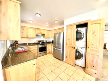 kitchen with washer and dryer inside Suite