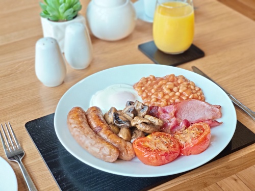 Full English breakfast with local Exmoor sausages, Exmoor bacon, Fenton farm eggs, mushrooms, tomatoes and baked beans