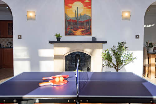 ping-pong table in the conservatory games room, ideal for family fun, friendly competitions, and keeping everyone entertained