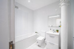 Bright bathroom with essential amenities for a comfortable stay
