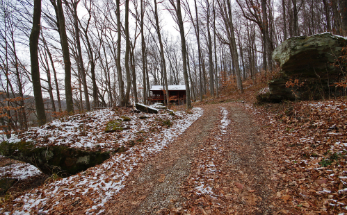 Longer view of lane, rocks and Snuggle Inn