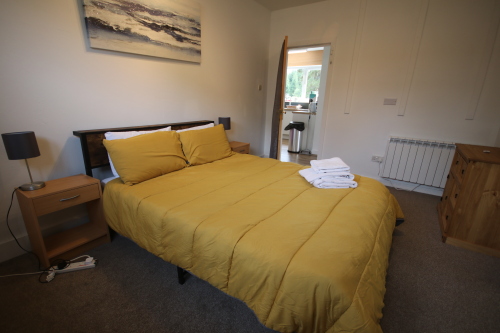 Main bedroom showing coverless duvets