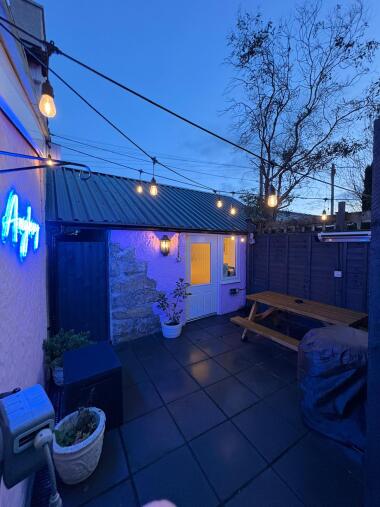 Private garden with festoon lighting