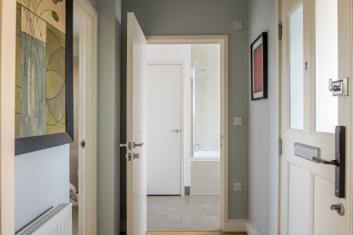 A stylish and welcoming hallway, finished with elegant details and refined lighting, sets the tone for the entire home. Its clean lines and sophisticated design create a grand first impression from the moment you enter.