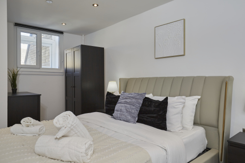 Your private retreat: a stylish double bedroom with a calm, welcoming feel.