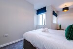 Comfortable bedroom with a king-size zip and link bed that can be separated into two singles upon request.