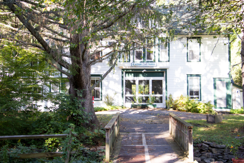 Cross a bridge to the Carraige House which is home to guest rooms 14-22 and our Art Studio.